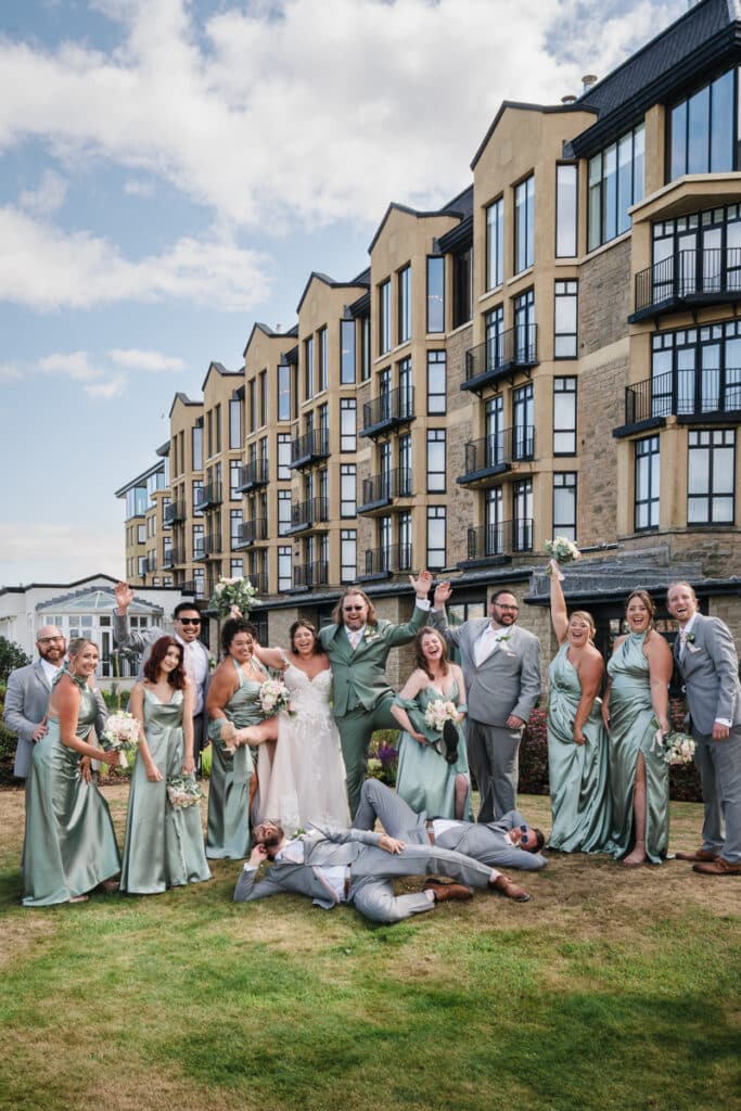 The full bridal party outside with the Old Course Hotel behind them