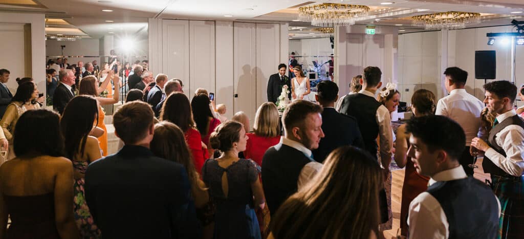 Bride and groom cut their cake at the Old Course Hotel