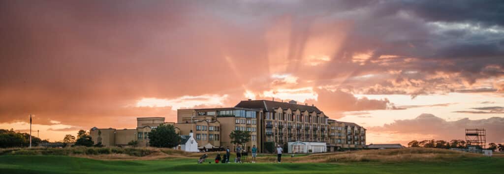 The sun sets behind the Old Course Hotel in St Andrews